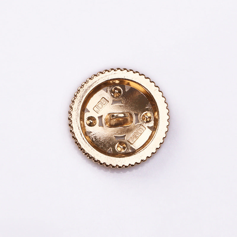 Button back: gold-tone metal shank with screw posts and ridged edge