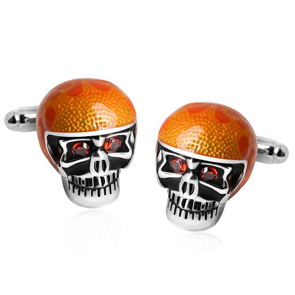 Glänzende orange Skull-Manschettenknöpfe mit schwarzen Emalldetails, roten Augen