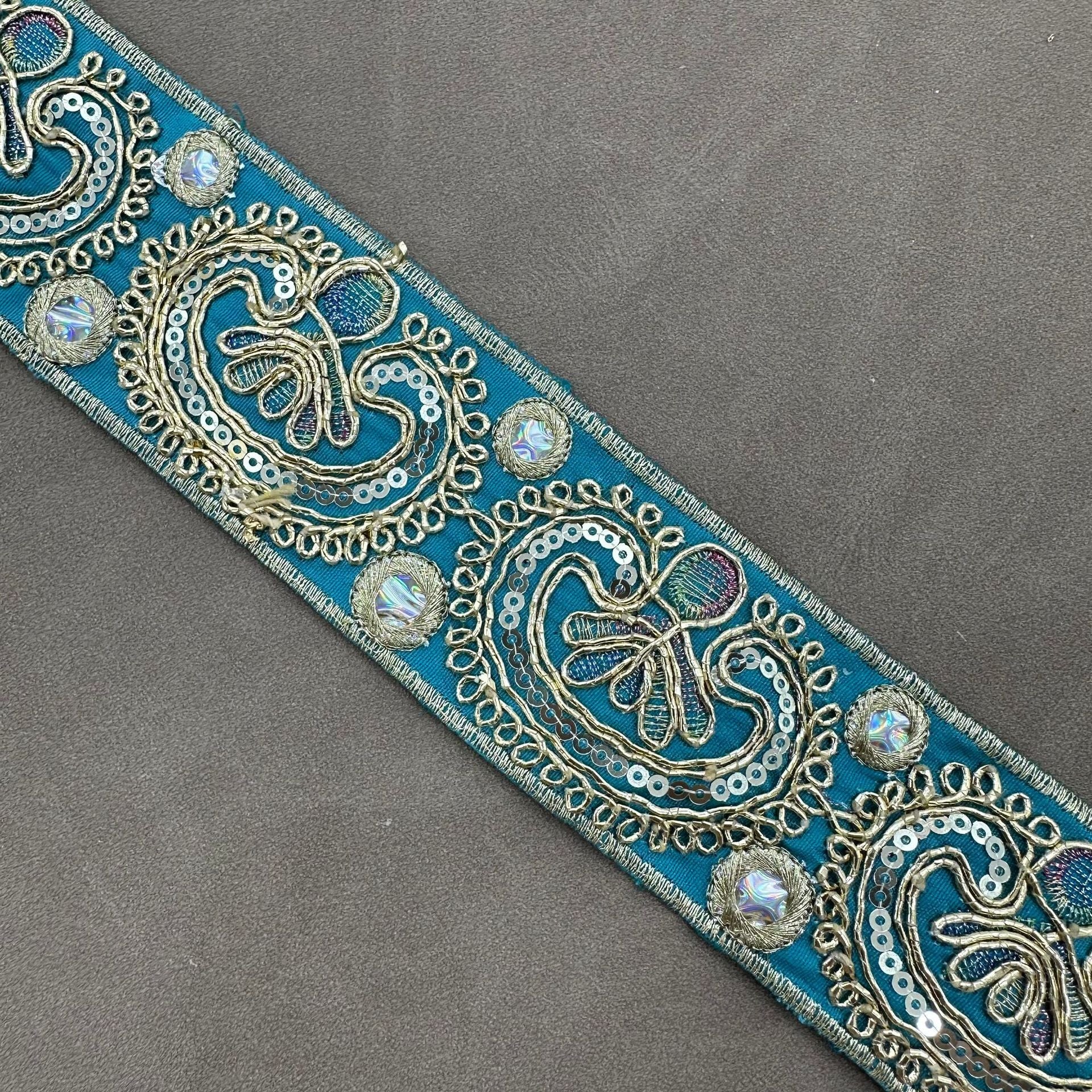 Teal embroidered trim with paisley sequin cord details and gold-toned accents