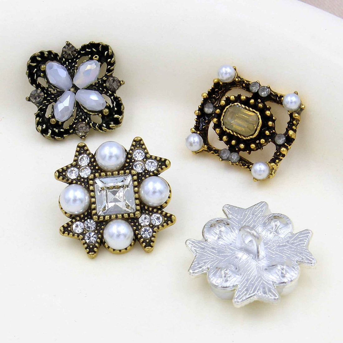 Silver star shank button with pearls and rhinestone square center