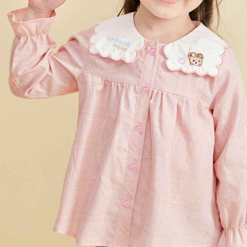 Pink kids shirt with heart-shaped buttons at the front