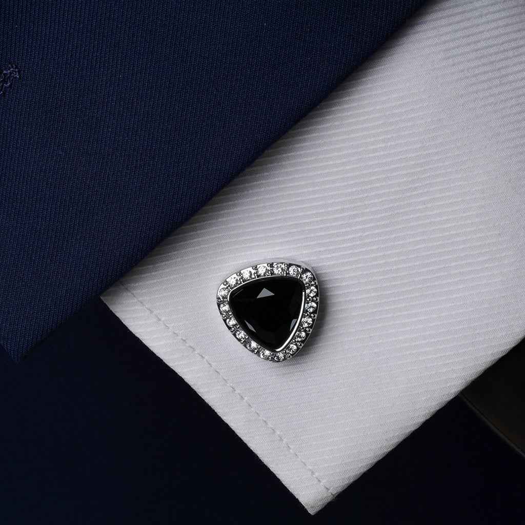 Black triangle onyx cufflink with crystal trim on white shirt cuff