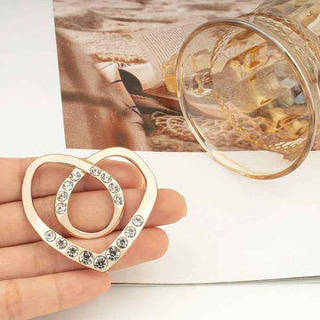 Heart-shaped rhinestone button, silver tone with round crystal stones