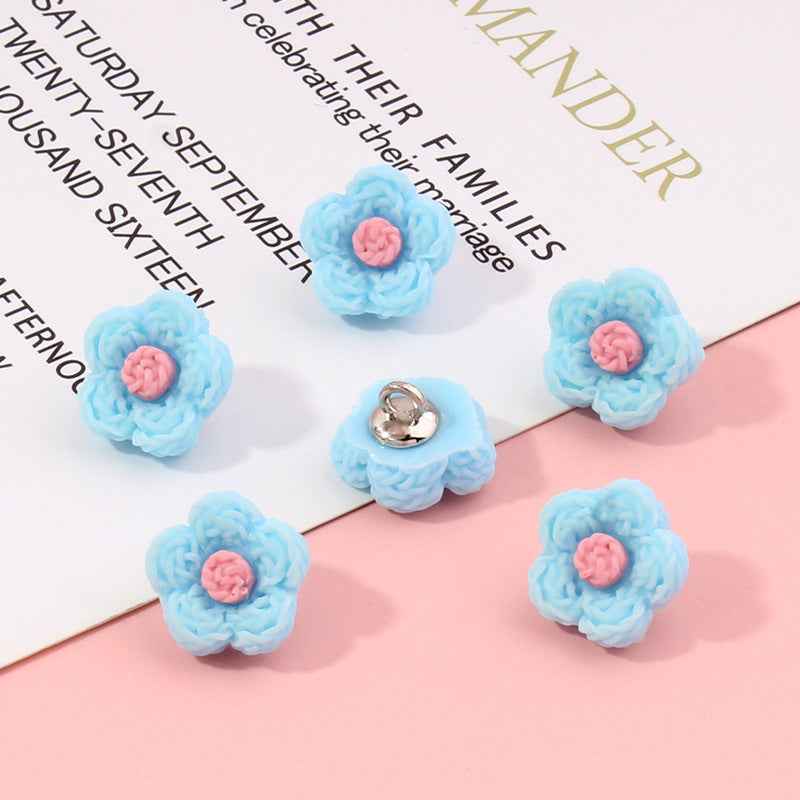 Light blue flower plastic buttons, 13mm; pink centers, silver shank