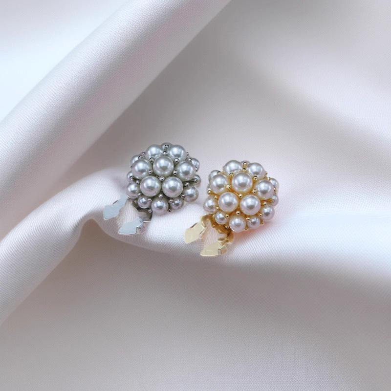 Pearl flower metal clamp buttons, silver and gold-tone with white pearl clusters.