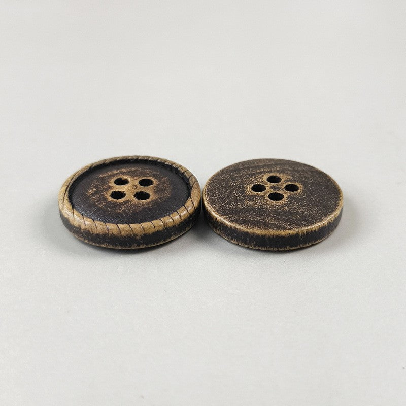 Pair of round 4-hole dark brown buttons with tan stitched rims