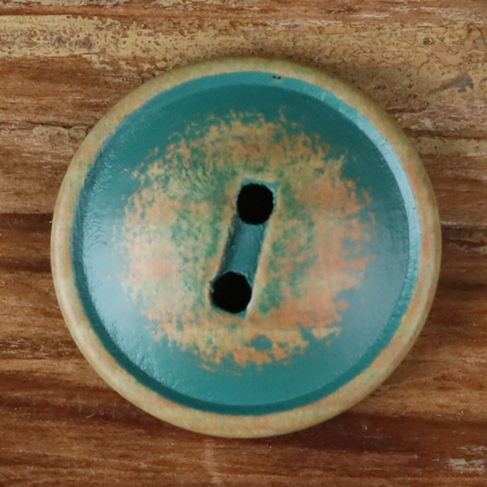 Round teal wood 2-hole button with two dark holes, close-up