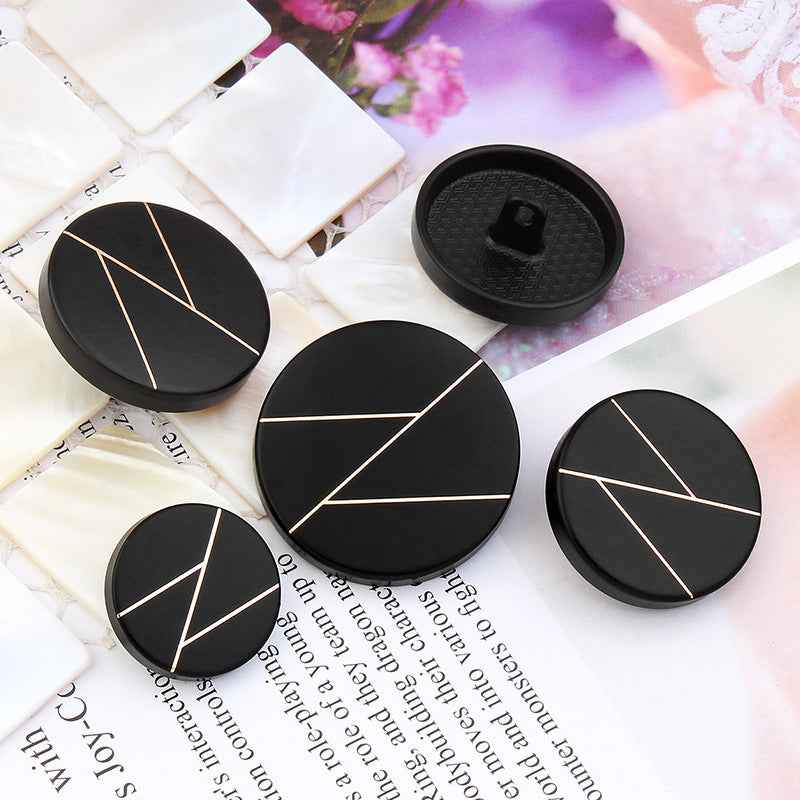 Black round coat buttons with metal shanks, gold geometric stripe pattern