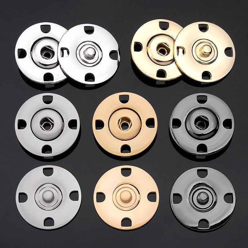 Mixed-color hidden snap buttons: silver, gold, and gun black, round discs with 4 notches