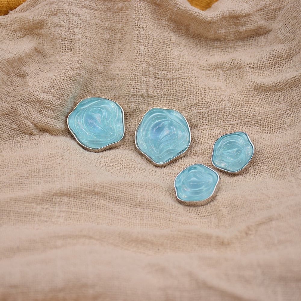 Transparent floral resin buttons, light blue with gold-tone metal edging