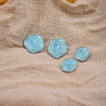 Transparent floral resin buttons, light blue with gold-tone metal edging