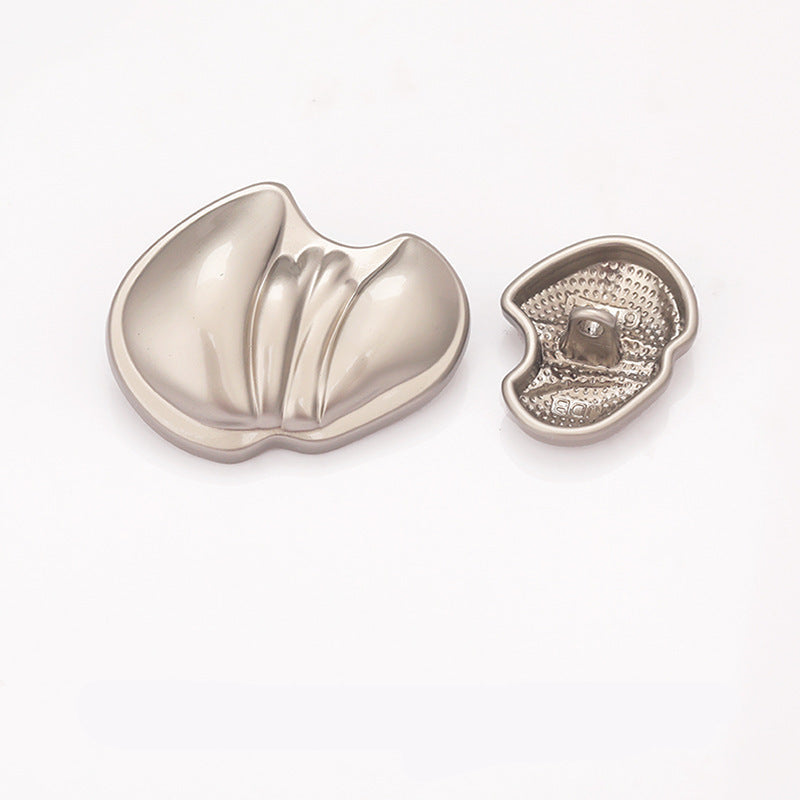 Paw-shaped metal shank button, light gold finish, reflective front