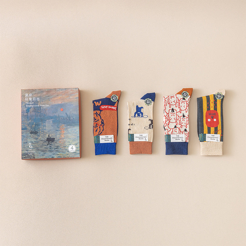 Monet-style cotton socks 4-pack: orange, blue, cream, and white art motifs with rib cuffs