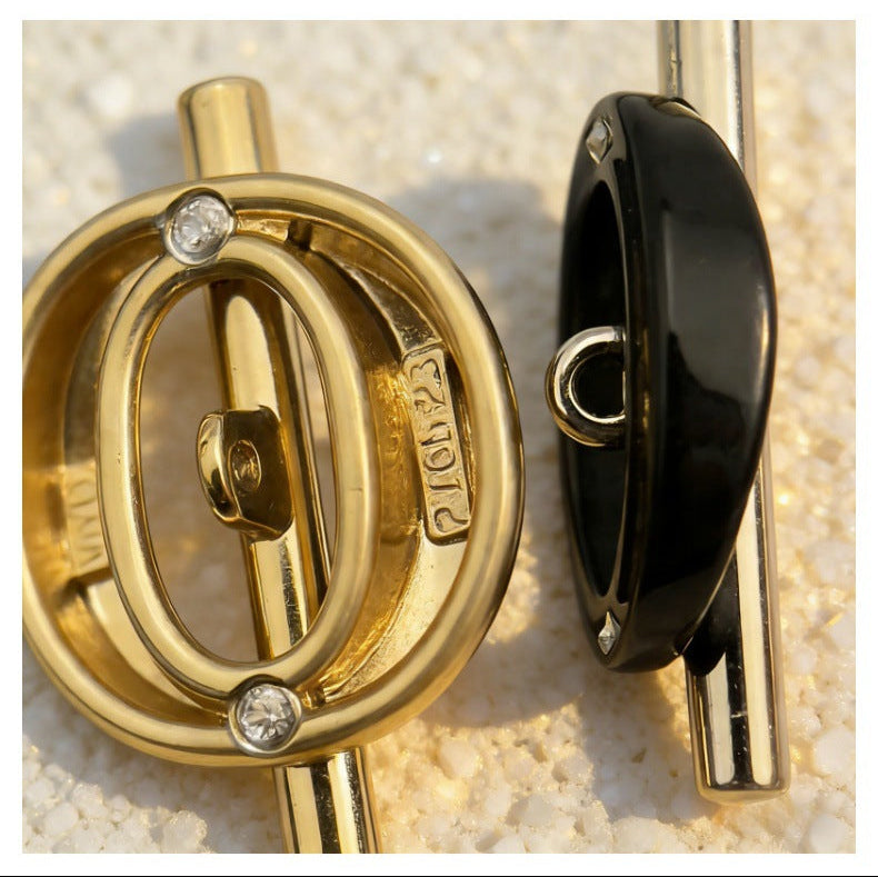 Gold- und schwarzfarbene Hohlknöpfe, rundes Ringdesign mit Stab, mit Strasspunkten