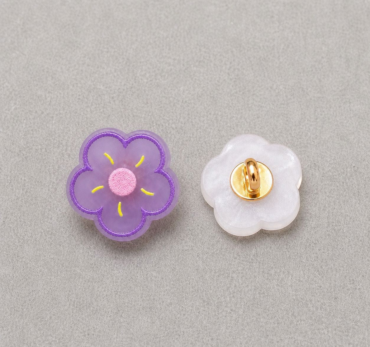 Floral resin shank button set: purple flower front, translucent back