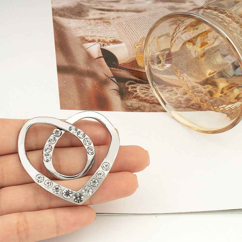 Heart-shaped rhinestone button, silver tone with round crystal stones