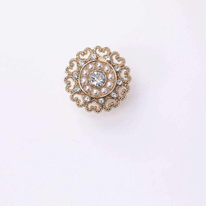 Gold round decorative button with pearl ring, center rhinestone, and lace filigree edge