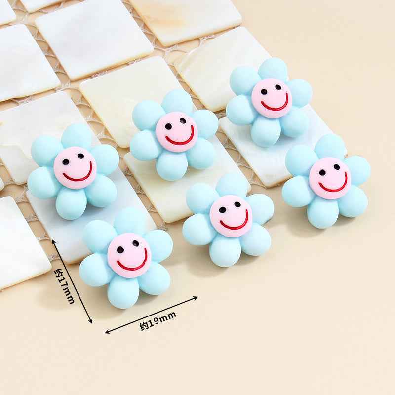 Light blue smiley flower plastic buttons with metal shanks, about 19mm size