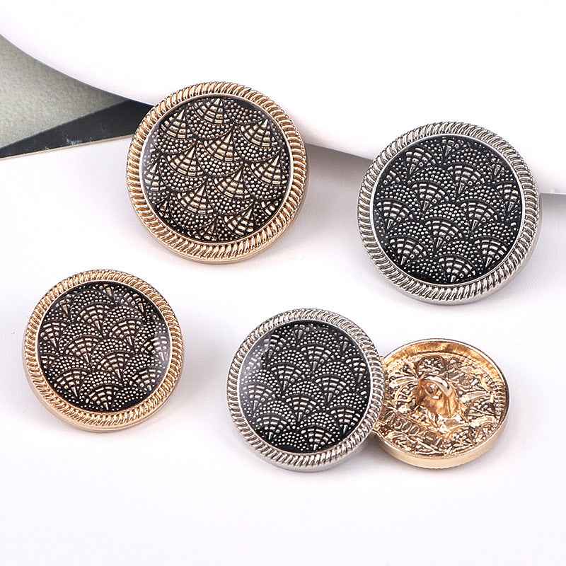 3/4 in fish-scale enamel shank button, gold rim, black patterned face