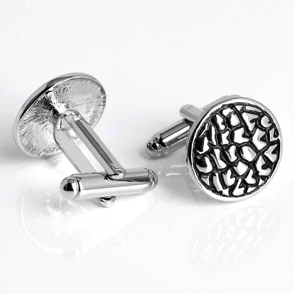 Silver-toned cufflinks with round black front and hinged bar-style back closures