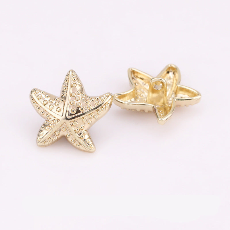 Light gold puffy starfish metal shank buttons, front and back views