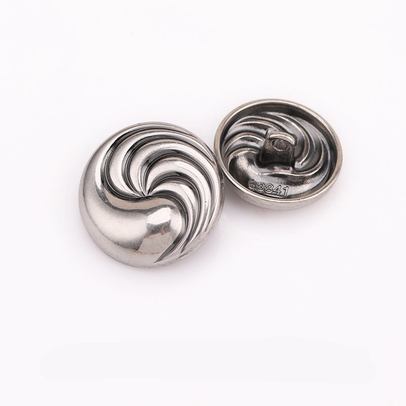 Silver spiral textured round metal shank button, front with decorative swirl pattern