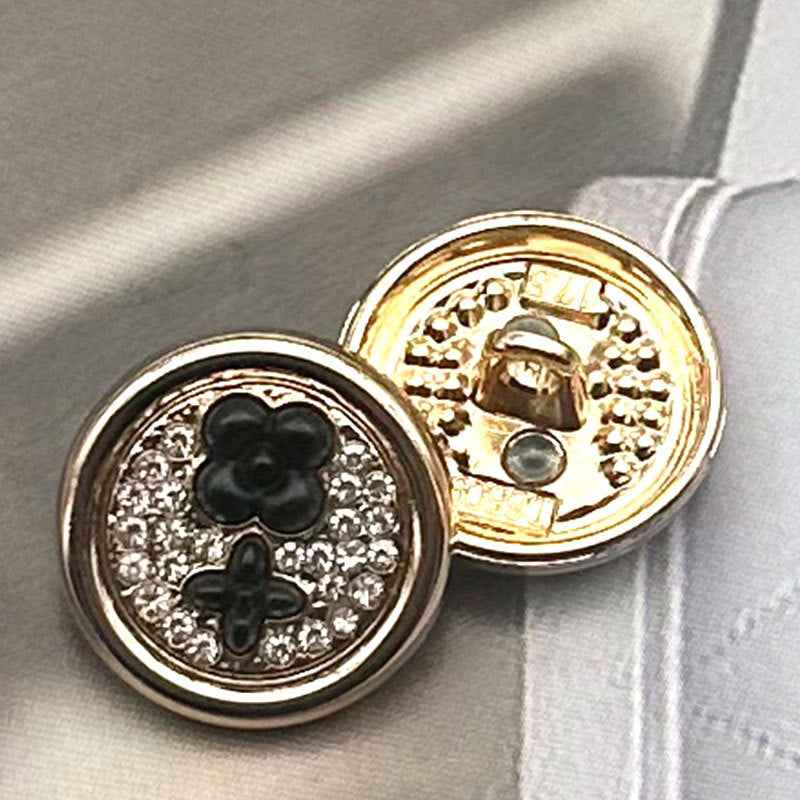 Round two-tone metal shank buttons, black clover front with gold-tone back and metal shank