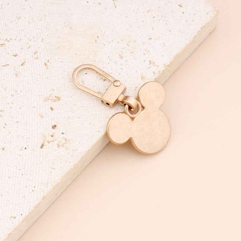 Gold-tone bear-shaped zipper pull replacement with loop handle and metal clip