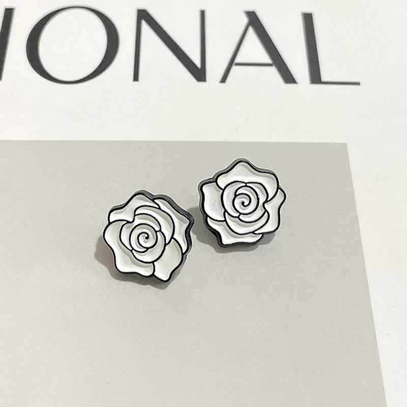 Two 12mm camellia floral metal shank buttons, white petals with black outline