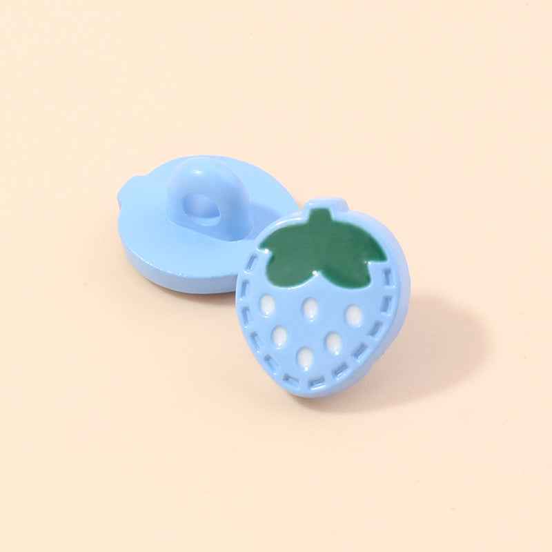 Light blue strawberry-shaped plastic shank button with green leaf and white dot holes