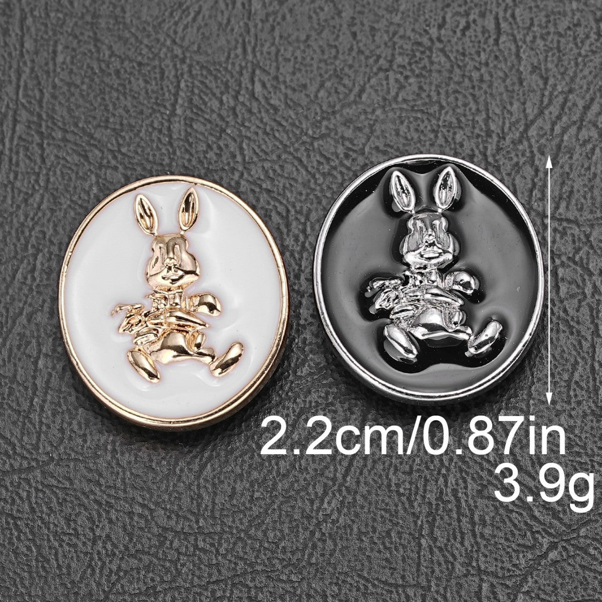 Two 22mm rabbit oval shank buttons: white gold and black silver