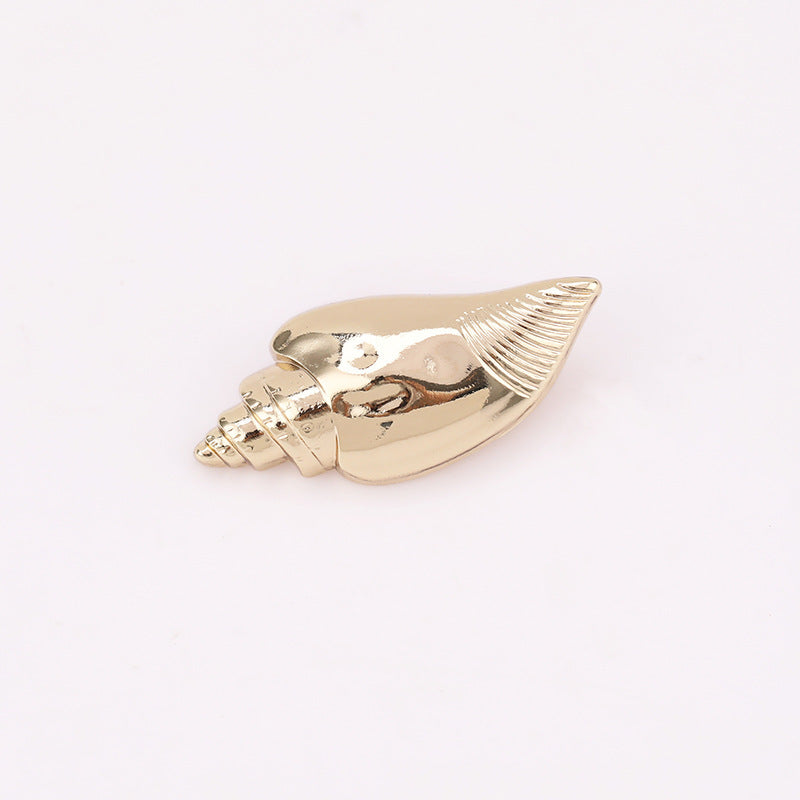 Conch shell metal shank button (Light Gold) side view with ridged pattern