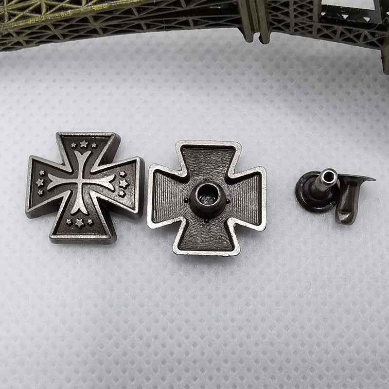 Silver cross-shaped rivet studs with star detailing, shown with one stud back.