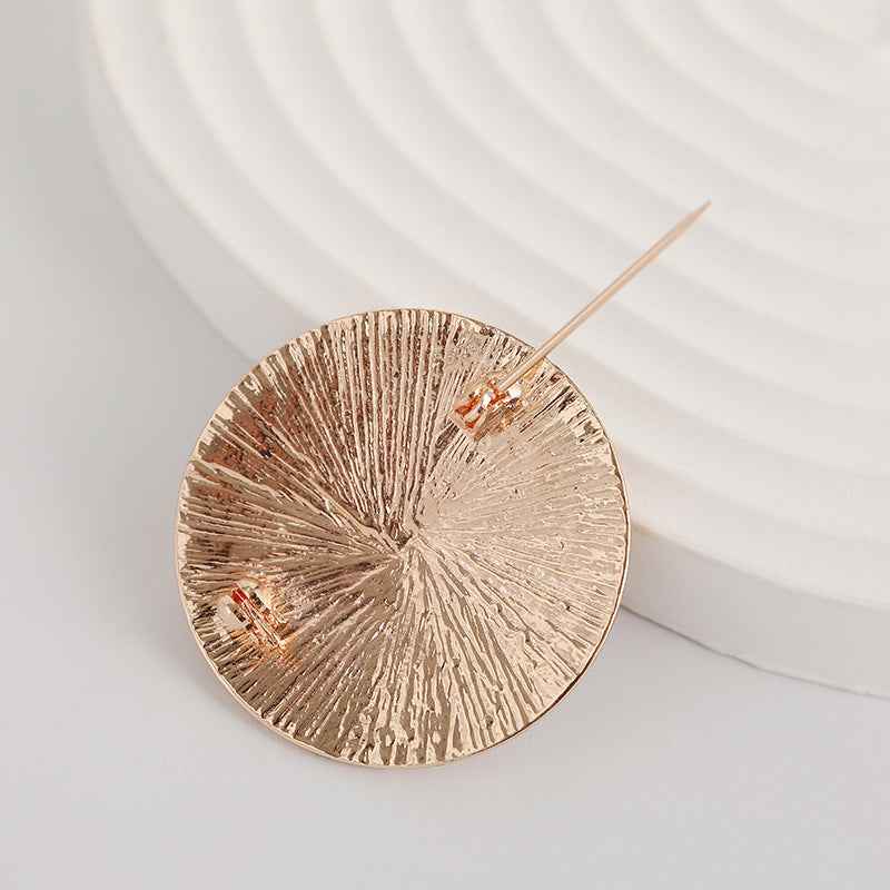 Vintage star brooch, rose-gold 8-point design with black enamel panels