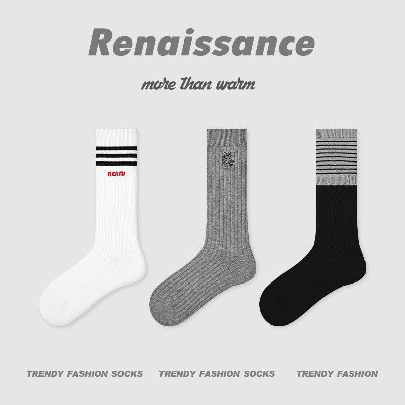 3-pack socks: white with black stripe, medium grey with small graphic, black with striped top