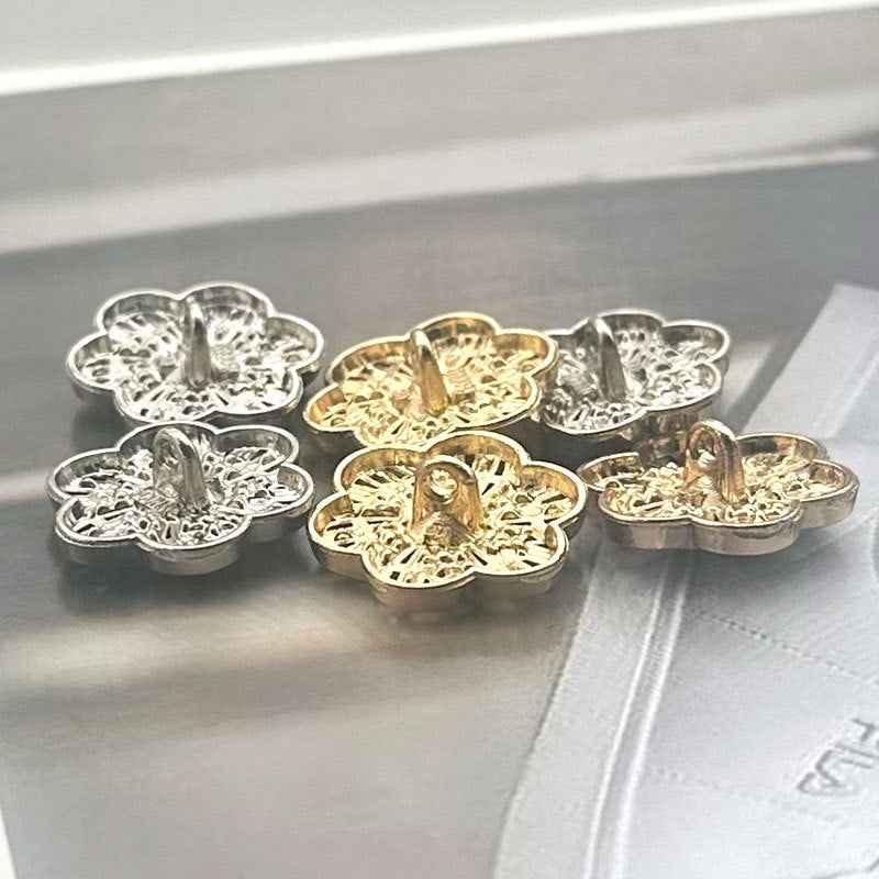 Floral crystal coat buttons with gold shank, round cutouts and center gem detail