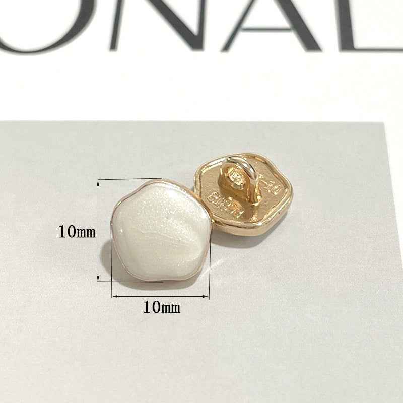 10mm metal shank button with black pearl-look front and gold back