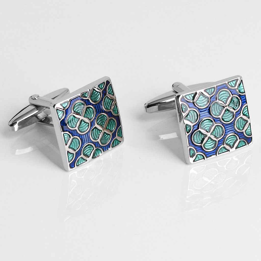 Square enamel cufflinks with blue enamel and green clover-like motifs, silver bar backs.