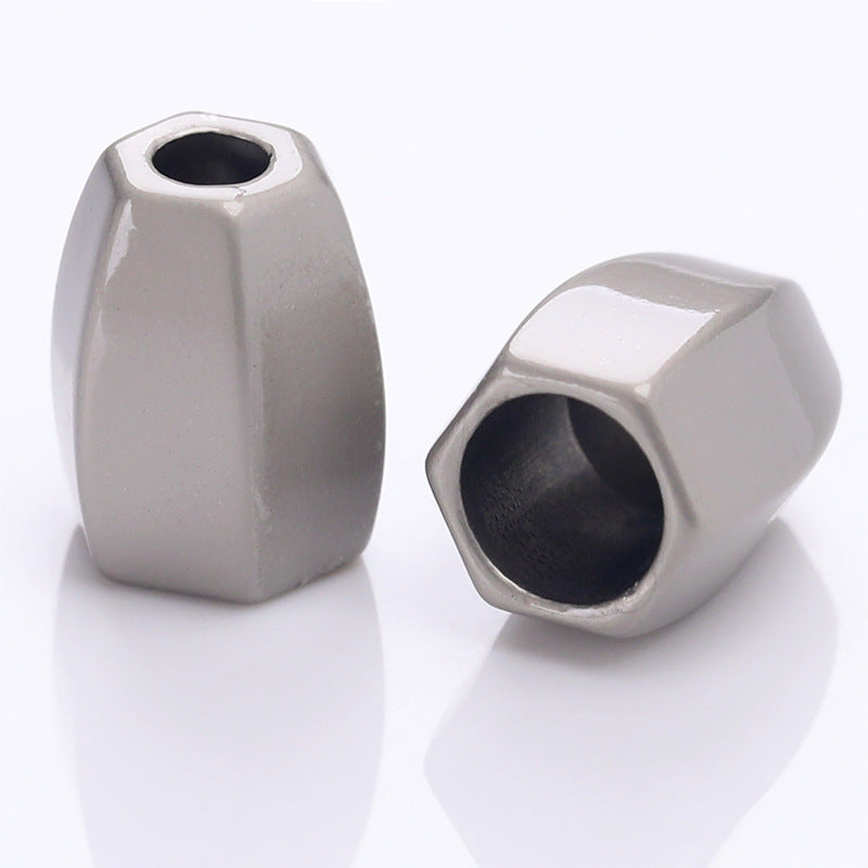 Silver diamond-shaped metal cord lock stopper with round inner hole, faceted body