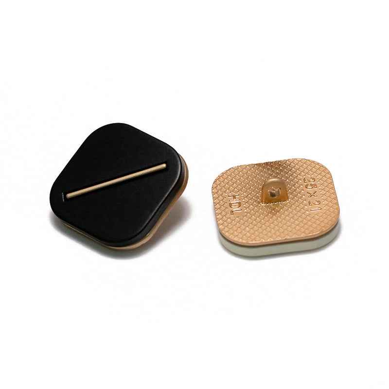Back view of square resin shank buttons: black and tan, metal base rivet