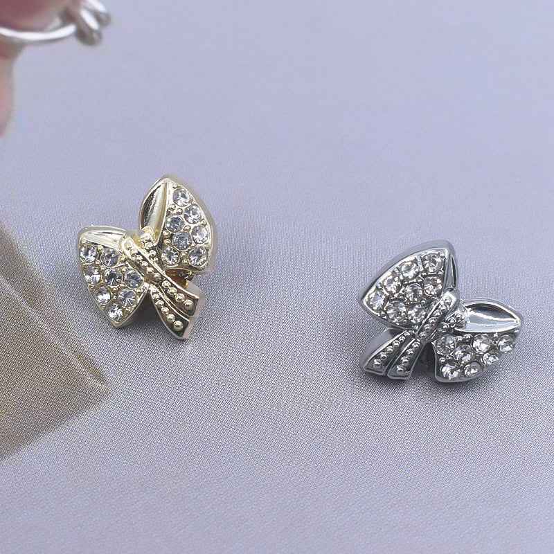 Rhinestone shirt buttons: gold and silver bow designs with gem center and trim