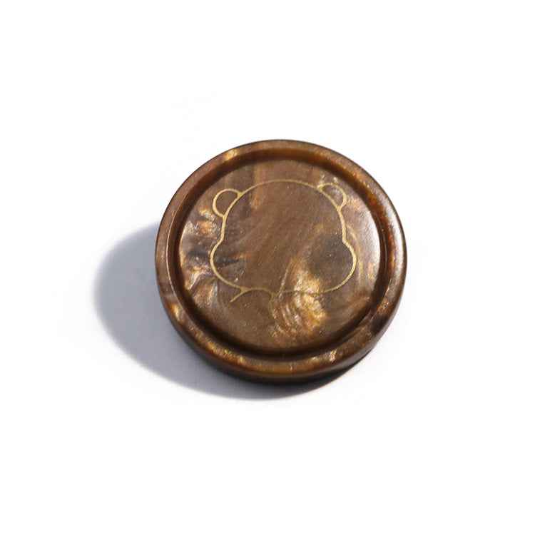 Brown bear resin shank button with gold cartoon bear outline on front