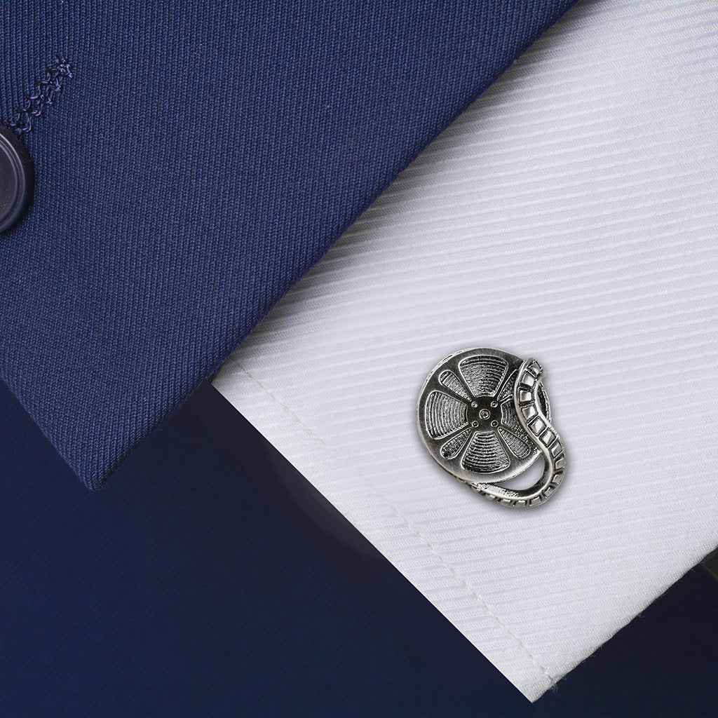 Antique silver film projector cufflink pin on white shirt cuff