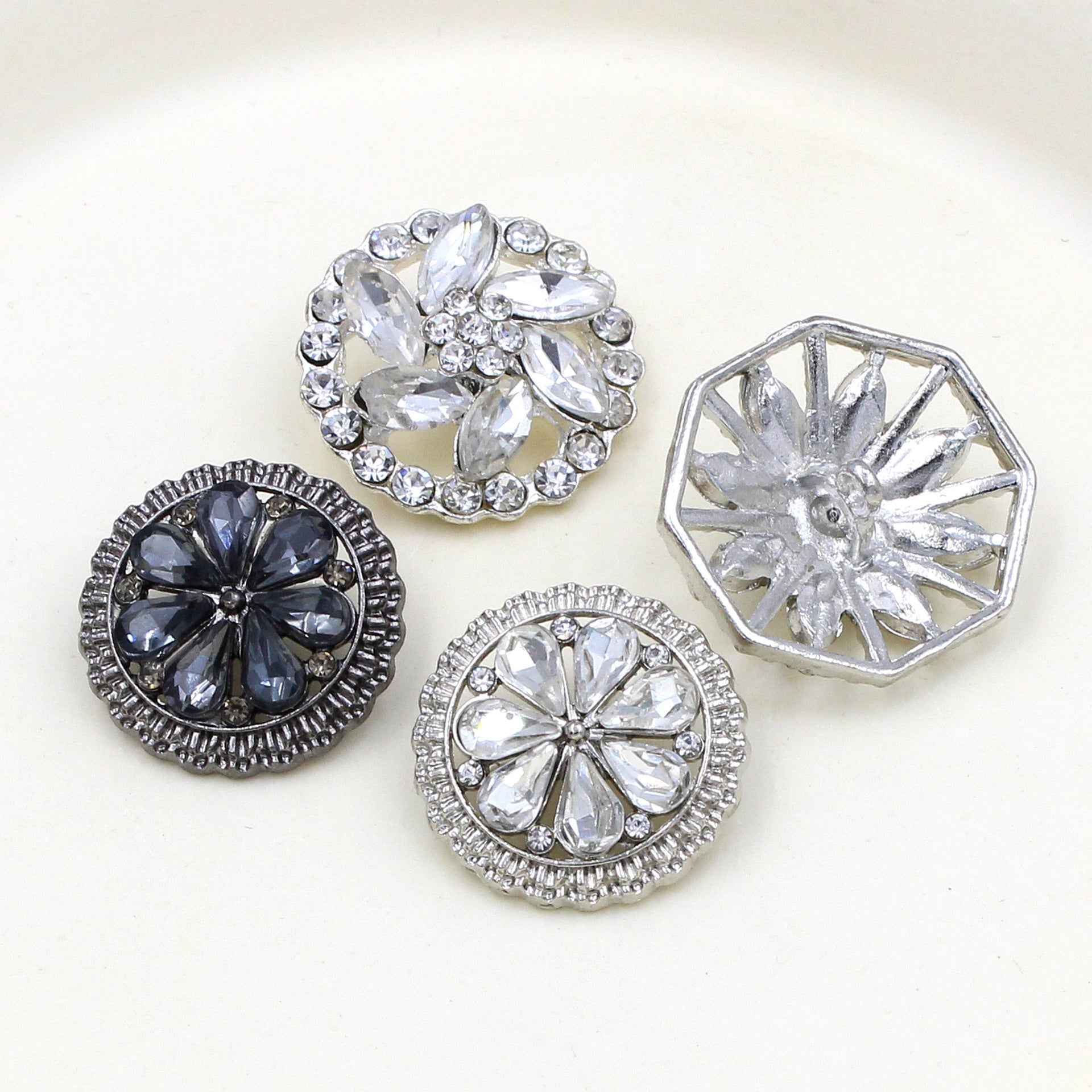 Round sew-on rhinestone alloy buttons with clear and dark stones, silver frames