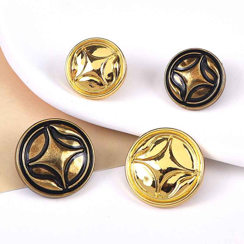 Four-point star metal shank sewing buttons, gold and bronze tones, visible front designs