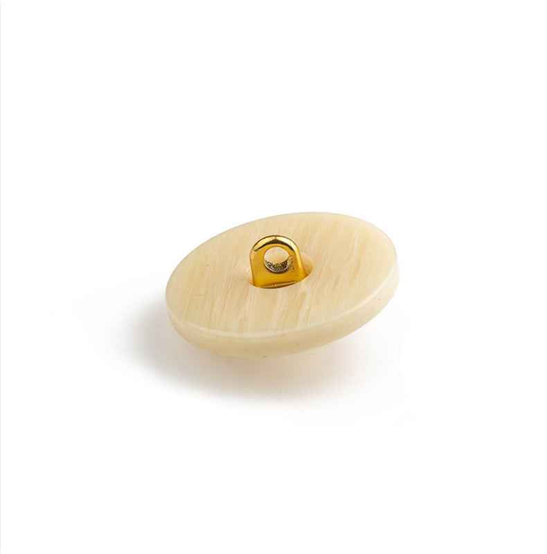 Beige round lion button back view with metal loop shank