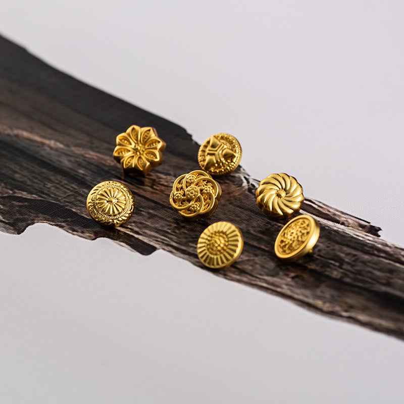 Gold Chinese-style shirt buttons with floral and sunburst front designs
