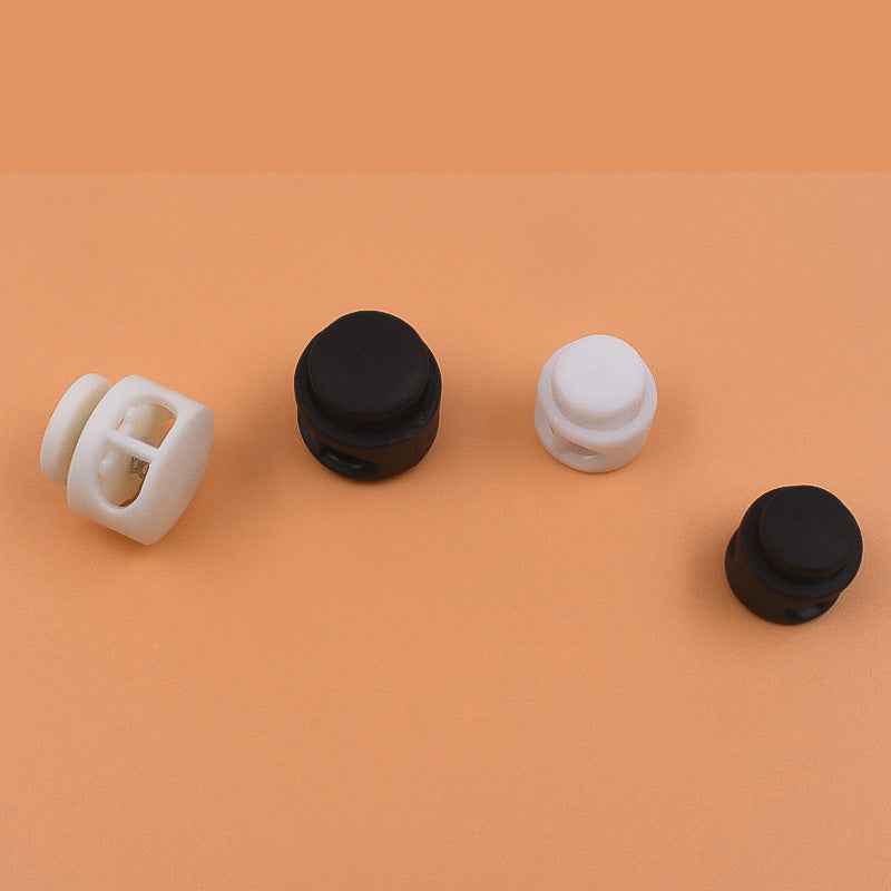 Plastic cord locks set: black and white round caps for drawstring cords