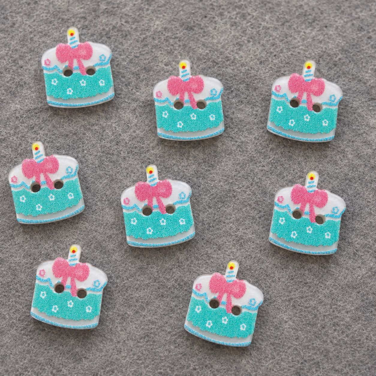 Resin cake buttons, light green with pink bow and candle, multiple pieces, two holes