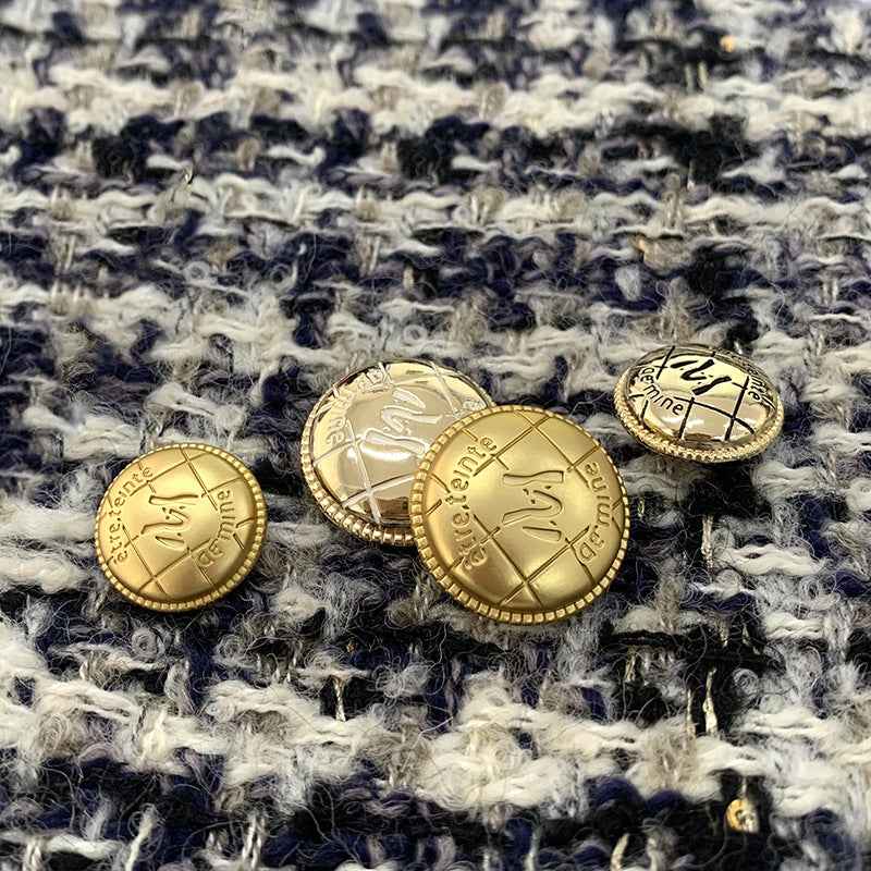Assorted gold round M-letter metal buttons with beaded rims and engraved faces
